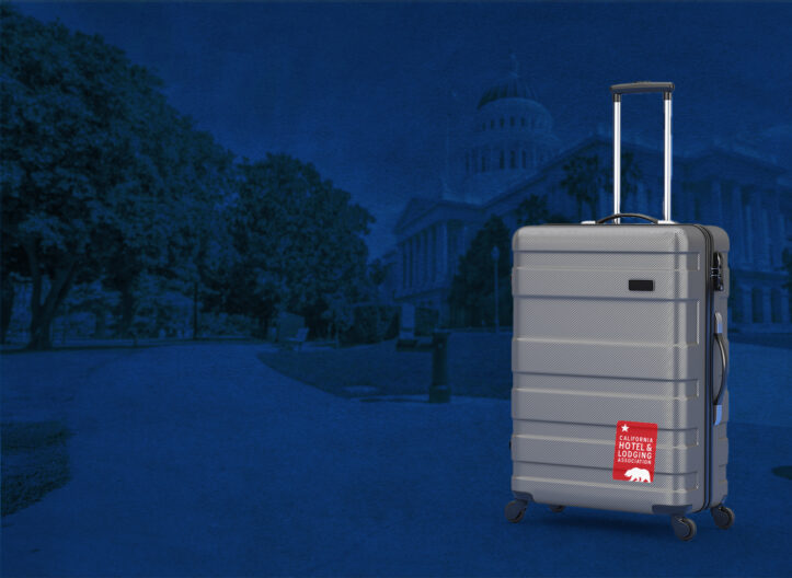 suitcase with CHLA sticker against a background of the capitol